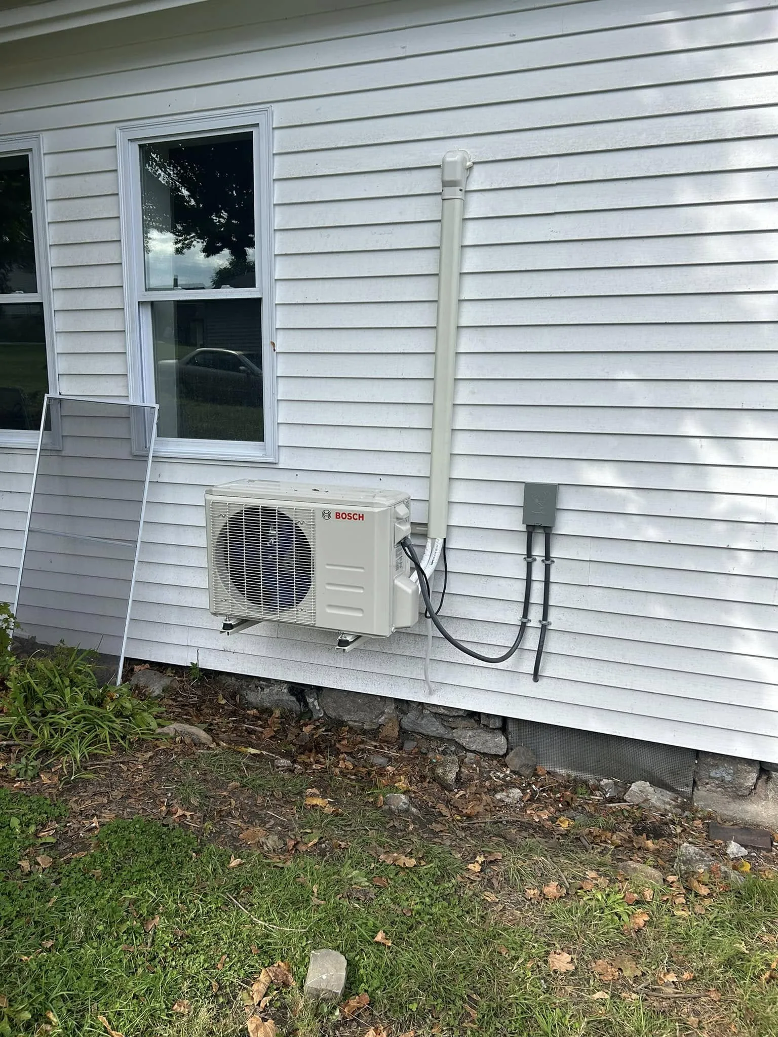 Bosch outdoor mini-split unit mounted beside a home